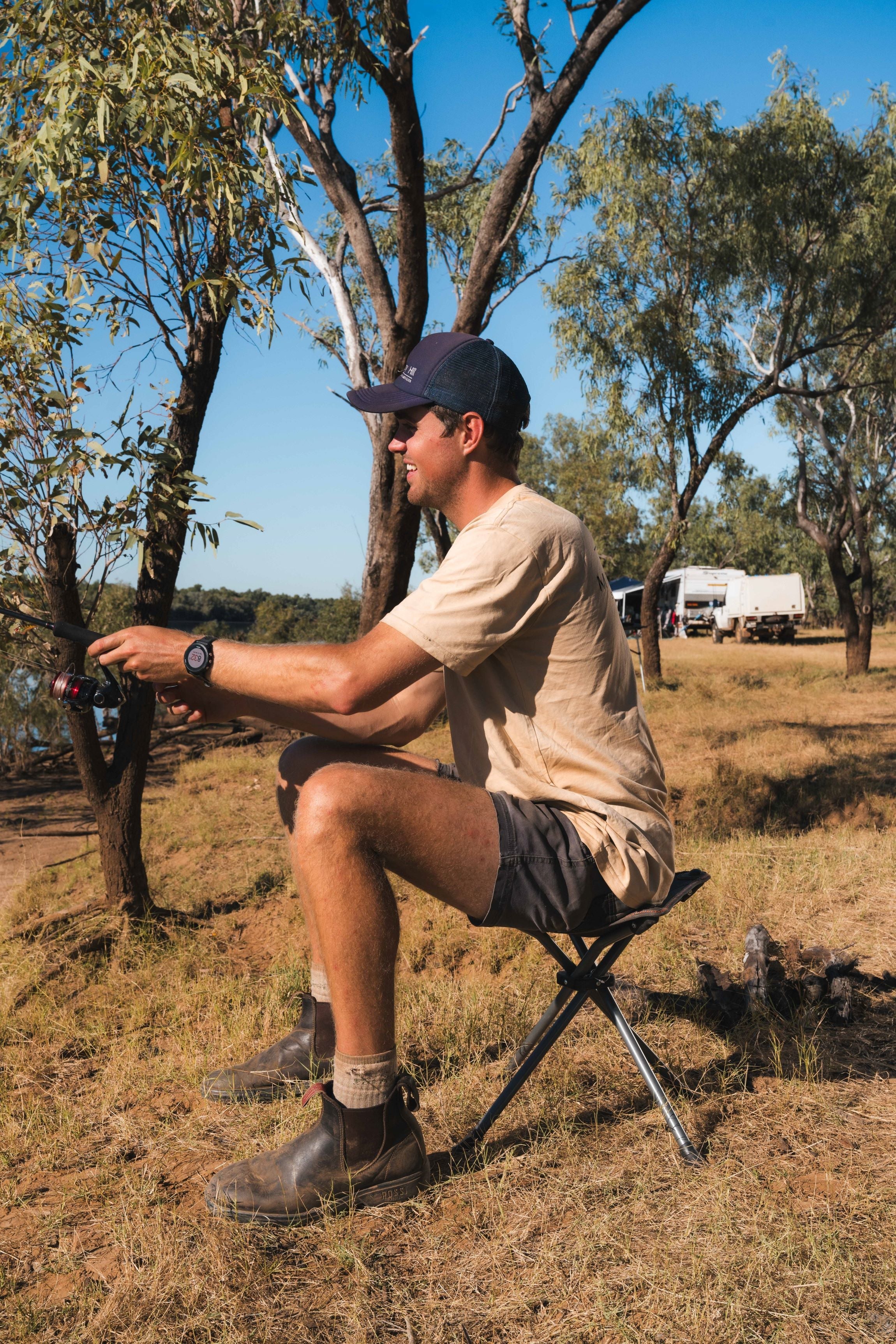 WILDTRAK™ AYR Foldable 4 Leg Stool, Compact, Lightweight, Fishing and Camp Chair, Weight Rated 120kg, Carry Bag with Shoulder Strap